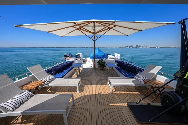Slide: The Image of Luxurious deck of 1986 Jongert 85 yacht with sun loungers and ocean view. - 5