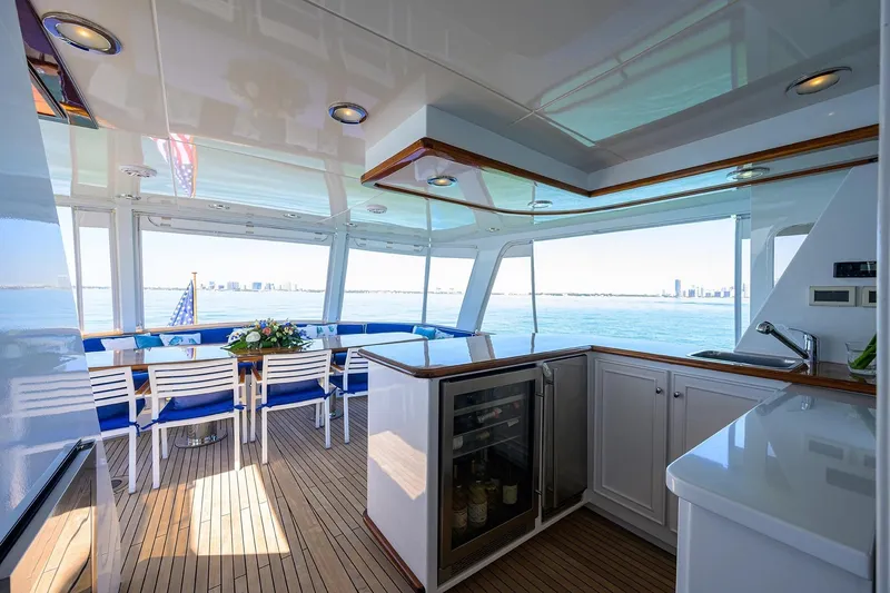 Slide: The Image of Luxurious 1986 Jongert 85 yacht interior with dining area, kitchenette, and ocean view. - 7