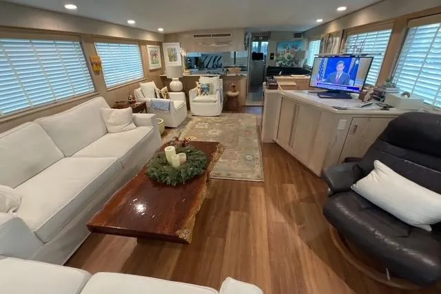 Slide: The Image of Luxurious interior of a 1997 Hatteras 70 Sport Deck Motor Yacht with elegant furnishings. - 10