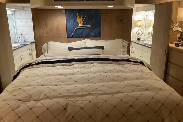 Slide: The Image of Luxurious bedroom interior of 1997 Hatteras 70 Sport Deck Motor Yacht. - 25