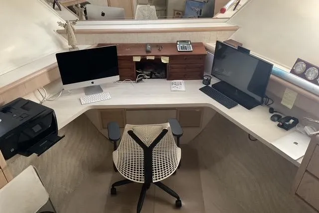 Slide: The Image of Office setup on 1997 Hatteras 70 Sport Deck Motor Yacht with dual monitors and ergonomic chair. - 29