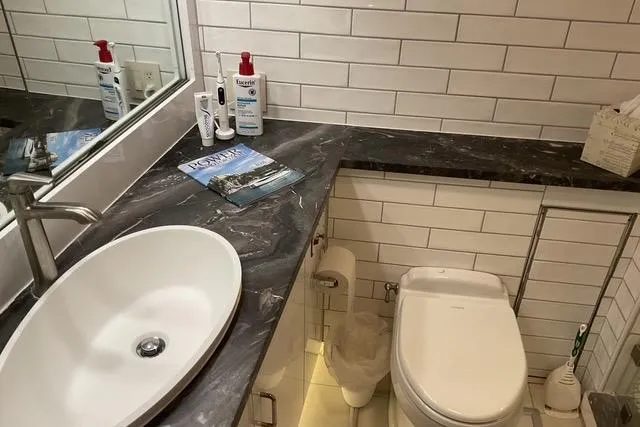 Slide: The Image of Bathroom interior of 1997 Hatteras 70 Sport Deck Motor Yacht with modern fixtures. - 34