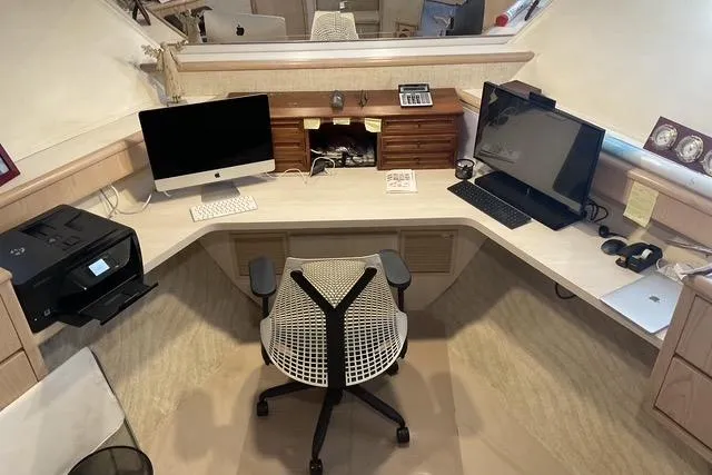 Slide: The Image of Office setup on 1997 Hatteras 70 Sport Deck Motor Yacht with computers and printer. - 37