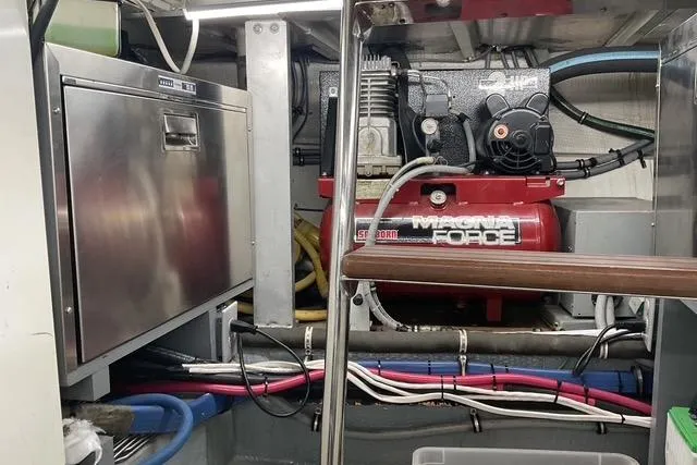 Slide: The Image of Engine room of 1997 Hatteras 70 Sport Deck Motor Yacht with machinery and wiring. - 52