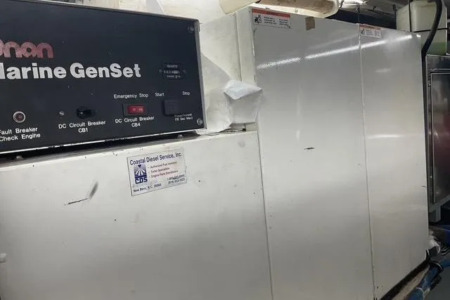 Slide: The Image of Engine room of 1997 Hatteras 70 Sport Deck Motor Yacht with Onan Marine GenSet. - 55