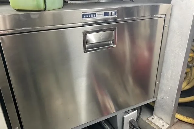 Slide: The Image of Stainless steel appliance on 1997 Hatteras 70 Sport Deck Motor Yacht. - 56