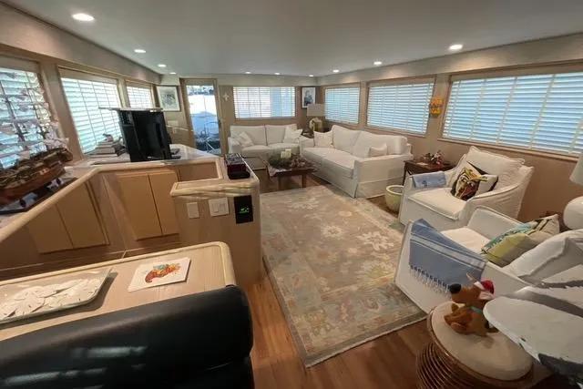 Slide: The Image of Luxurious interior of a 1997 Hatteras 70 Sport Deck Motor Yacht with elegant furnishings. - 8