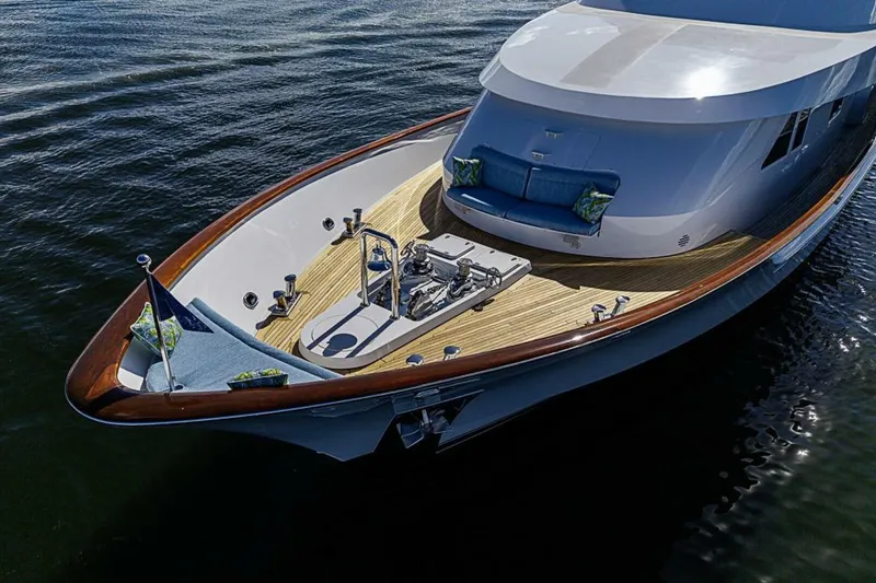 Slide: The Image of Luxurious 1997 Delta 122 Tri-Deck Motor Yacht with elegant deck and seating area. - 12