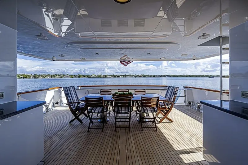 Slide: The Image of Luxurious deck of 1997 Delta 122 Tri-Deck Motor Yacht with ocean view and seating area. - 13