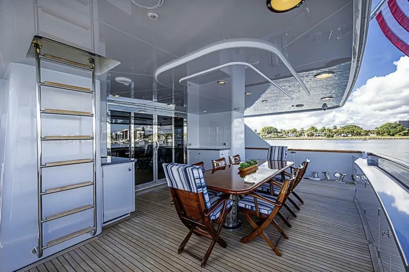 Slide: The Image of Luxurious outdoor dining area on 1997 Delta 122 Tri-Deck Motor Yacht. - 15