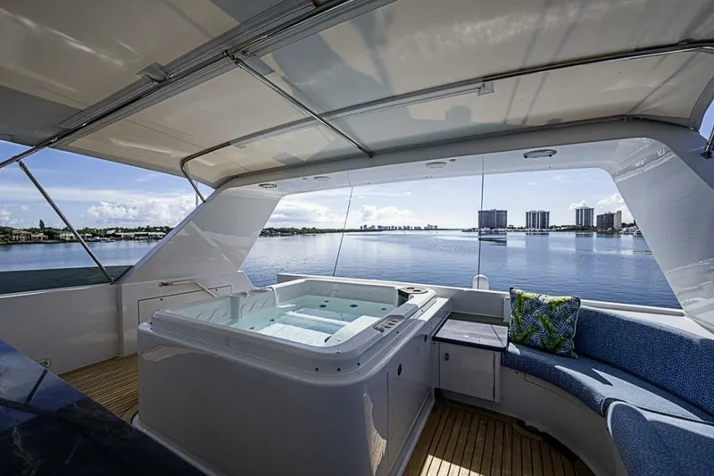 Slide: The Image of Luxurious Delta 122 Tri-Deck Motor Yacht with hot tub and scenic waterfront view, 1997 model. - 23