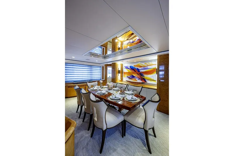 Slide: The Image of Luxurious dining area on 1997 Delta 122 Tri-Deck Motor Yacht with elegant decor. - 28