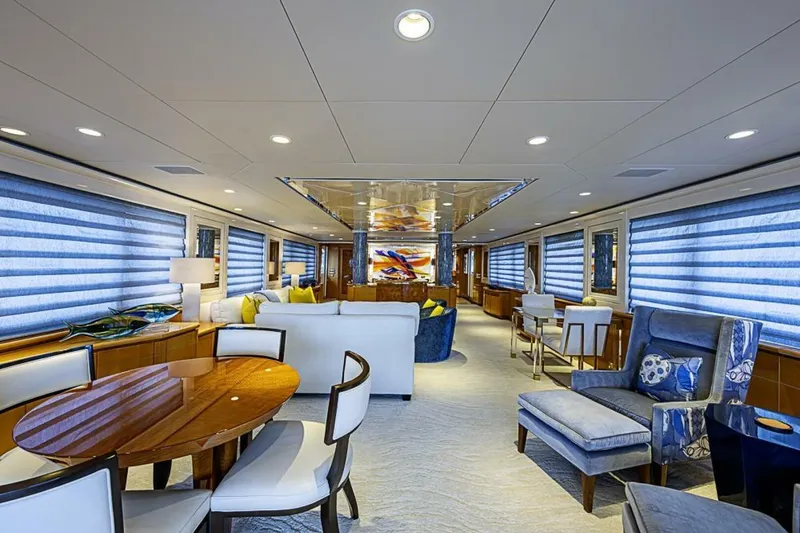 Slide: The Image of Luxurious interior of 1997 Delta 122 Tri-Deck Motor Yacht with elegant seating and dining area. - 3