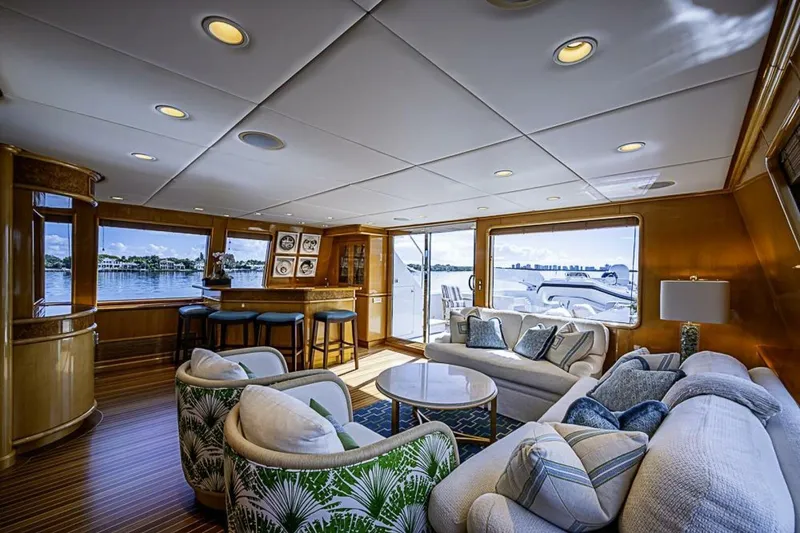 Slide: The Image of Luxurious interior of 1997 Delta 122 Tri-Deck Motor Yacht with elegant seating and bar area. - 31