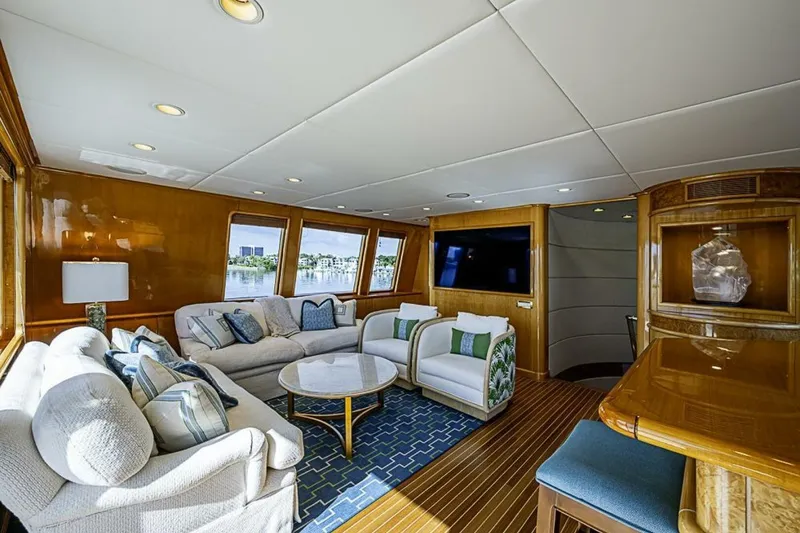 Slide: The Image of Luxurious interior of 1997 Delta 122 Tri-Deck Motor Yacht with elegant seating and large windows. - 32