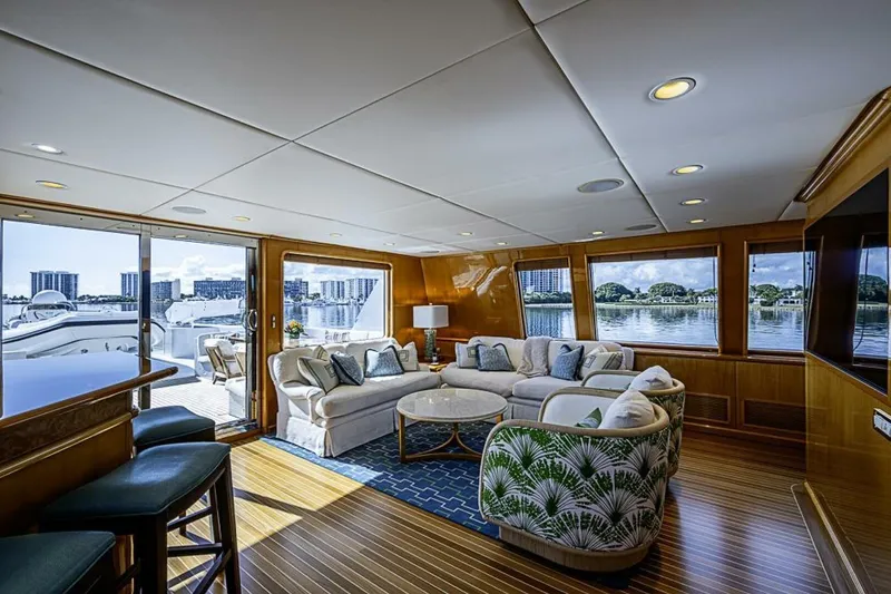 Slide: The Image of Luxurious interior of 1997 Delta 122 Tri-Deck Motor Yacht with elegant seating and scenic views. - 33