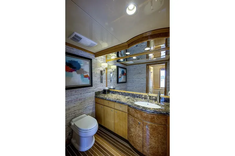 Slide: The Image of Luxurious bathroom on 1997 Delta 122 Tri-Deck Motor Yacht with elegant wood and marble finishes. - 35