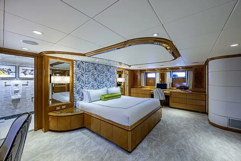 Slide: The Image of Luxurious bedroom interior of 1997 Delta 122 Tri-Deck Motor Yacht with elegant wood finishes. - 41