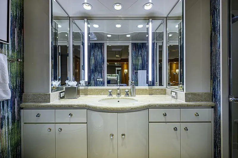Slide: The Image of Luxurious bathroom on 1997 Delta 122 Tri-Deck Motor Yacht with elegant fixtures and lighting. - 49