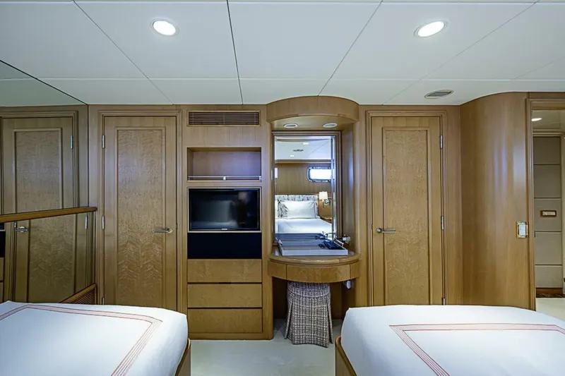 Slide: The Image of Luxurious cabin interior of 1997 Delta 122 Tri-Deck Motor Yacht with wood paneling. - 55
