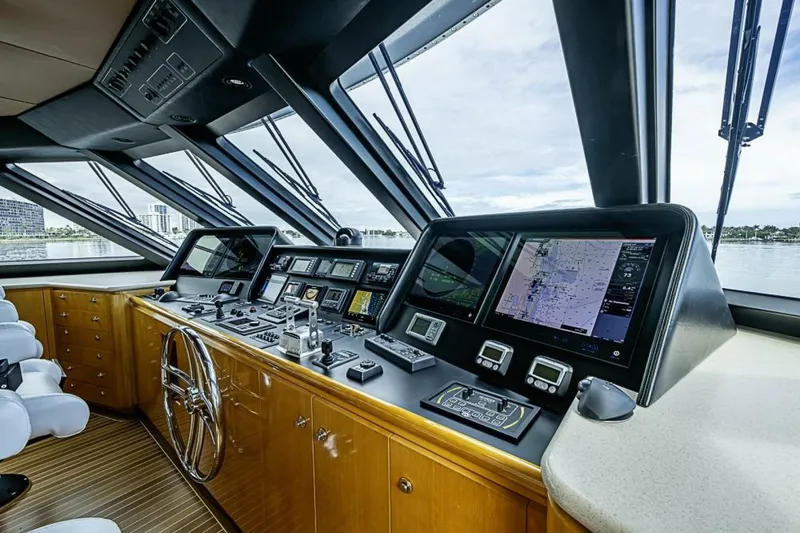 Slide: The Image of Bridge of 1997 Delta 122 Tri-Deck Motor Yacht with navigation equipment and panoramic windows. - 59