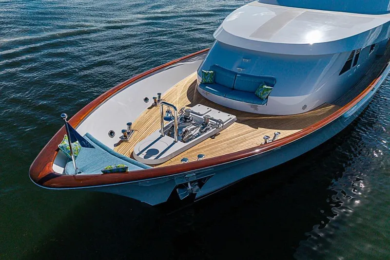 Slide: The Image of Luxurious 1997 Delta Marine yacht with sleek design and elegant wooden deck. - 11