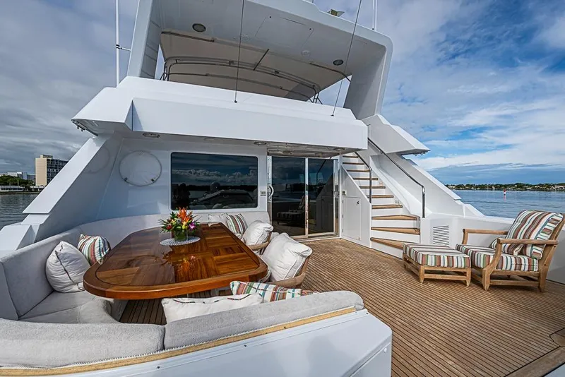 Slide: The Image of Luxurious 1997 Delta Marine yacht deck with elegant seating and ocean view. - 17