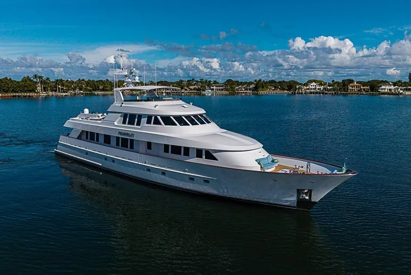 Slide: The Image of Luxurious 1997 Delta Marine yacht cruising on a serene blue waterway. - 2