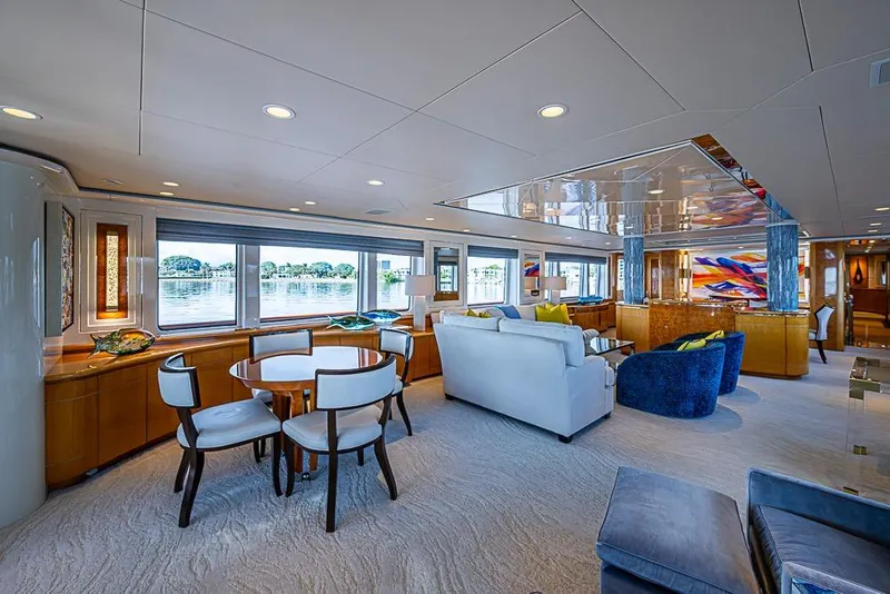 Slide: The Image of Luxurious 1997 Delta Marine yacht interior with elegant seating, dining area, and large windows. - 25
