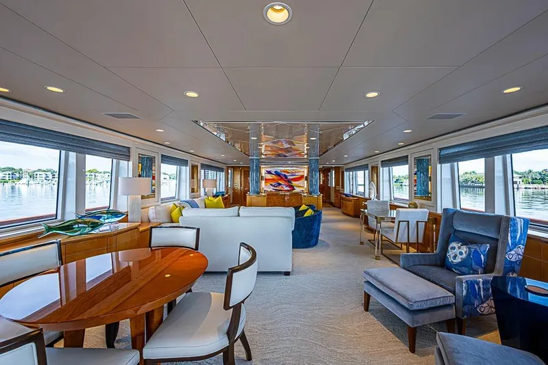 Slide: The Image of Luxurious 1997 Delta Marine yacht interior with elegant seating, dining area, and panoramic windows. - 27
