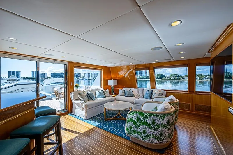 Slide: The Image of Luxurious 1997 Delta Marine yacht interior with elegant seating and scenic waterfront views. - 31