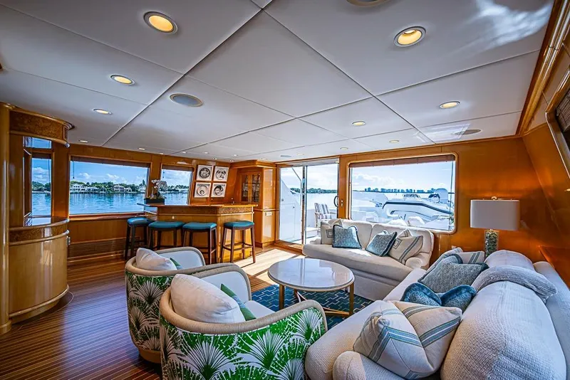 Slide: The Image of Luxurious 1997 Delta Marine yacht interior with elegant seating, bar, and scenic ocean views. - 32