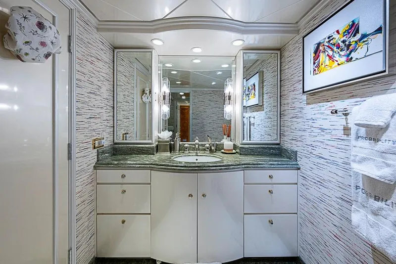 Slide: The Image of Luxurious yacht bathroom with modern decor, granite countertop, and abstract art, Delta Marine 1997. - 43