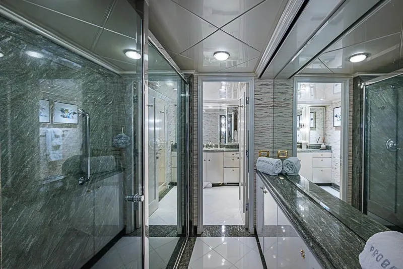 Slide: The Image of Luxurious yacht bathroom with marble finishes, glass shower, and elegant lighting, Delta Marine 1997. - 45