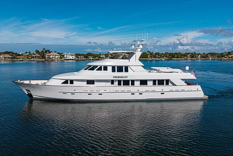 Slide: The Image of Luxury 1997 Delta Marine yacht on calm water under clear blue sky. - 5