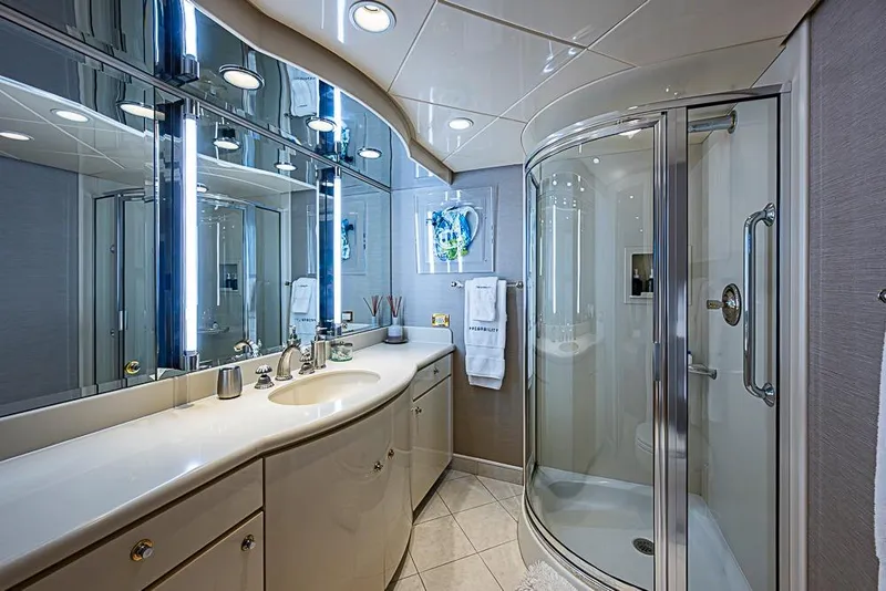 Slide: The Image of Luxurious yacht bathroom with modern fixtures, glass shower, and elegant lighting, Delta Marine 1997. - 50