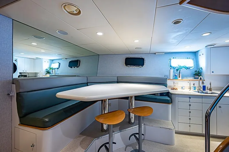 Slide: The Image of Luxurious 1997 Delta Marine yacht interior with dining area and kitchenette. - 59