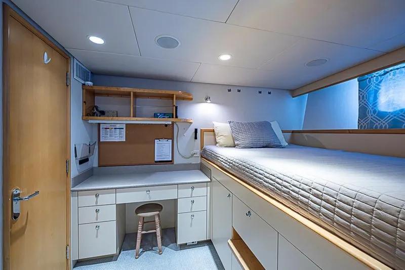 Slide: The Image of Luxurious 1997 Delta Marine yacht cabin with bed, desk, and storage. - 60