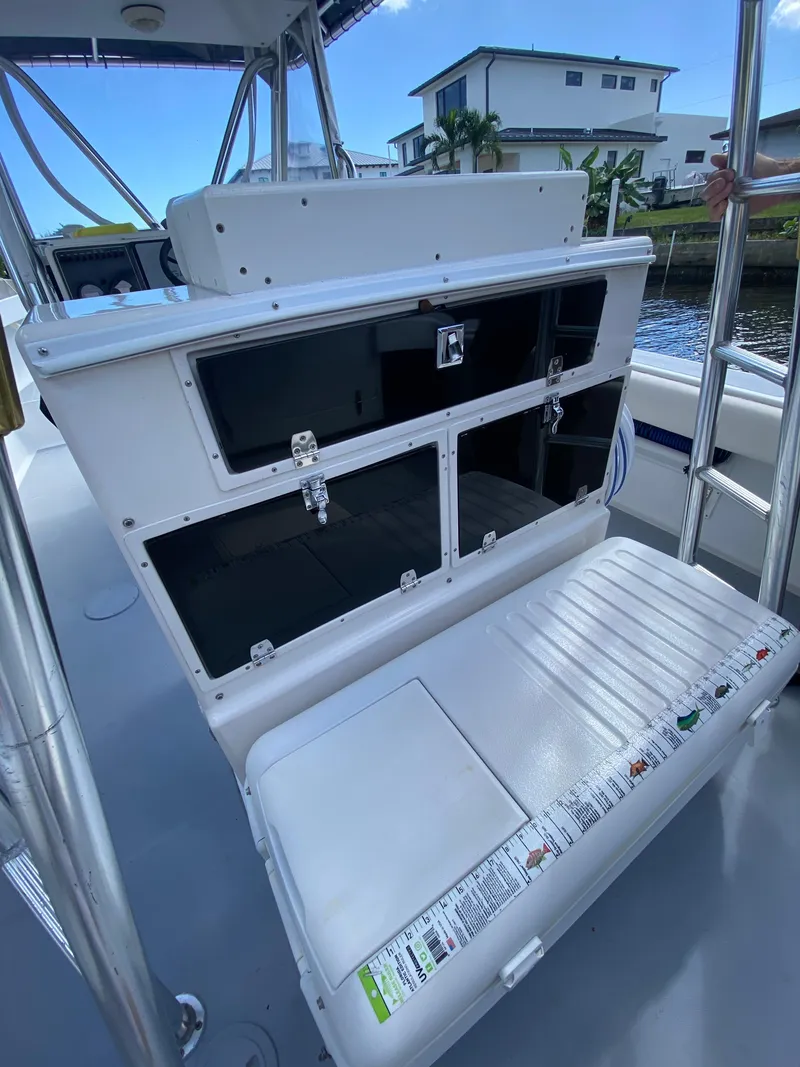 Slide: The Image of 1995 Ocean Master 3100 boat with open storage compartments on deck. - 15