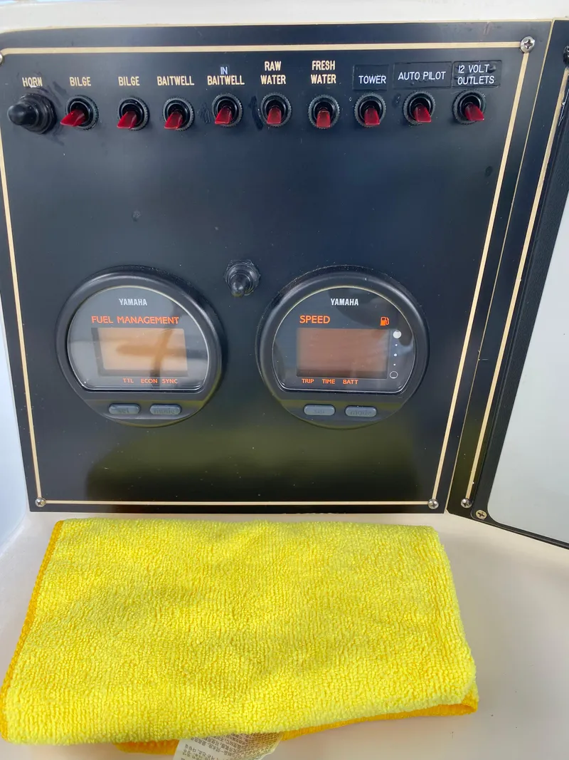Slide: The Image of Control panel of a 1995 Ocean Master 3100 boat with Yamaha gauges and switches. - 9