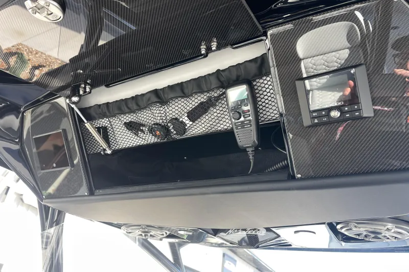 Slide: The Image of 2026 Nor- 390 Sport boat dashboard with radio and communication equipment. - 17