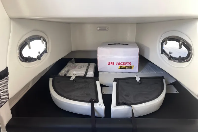 Slide: The Image of Interior of 2026 Nor- 390 Sport boat with life jackets and storage. - 25