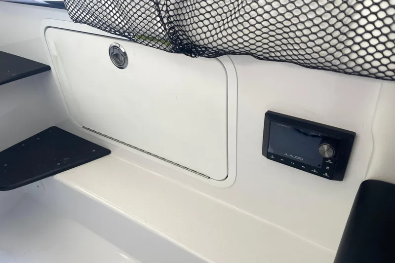 Slide: The Image of Interior of 2026 Nor- 390 Sport boat with JL Audio system and storage compartment. - 26