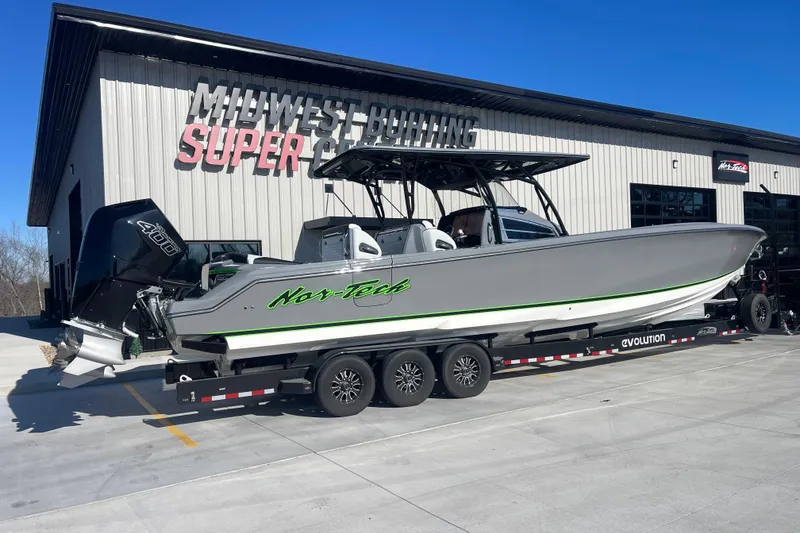 Slide: The Image of 2026 Nor- 390 Sport boat on trailer outside Midwest Boating Super Center. - 3