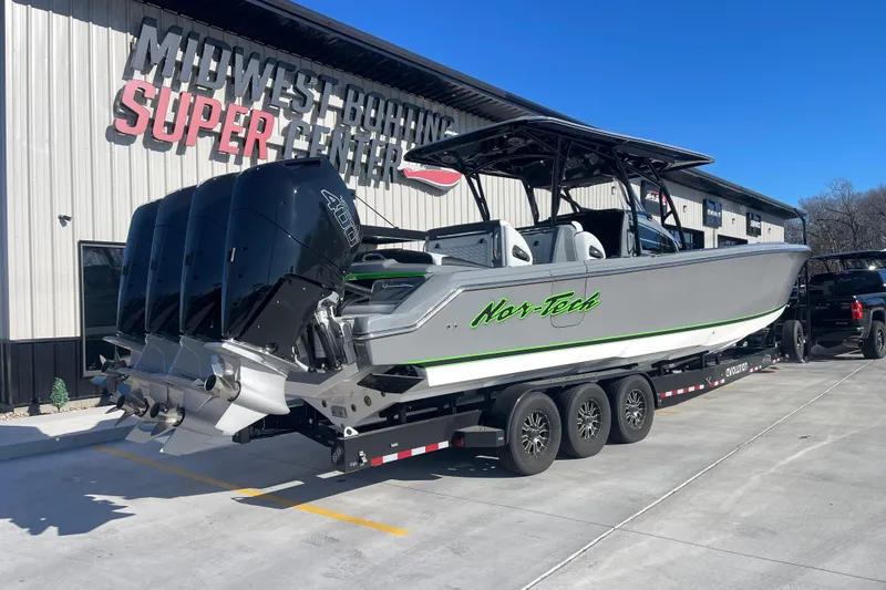 Slide: The Image of 2026 Nor-Tech 390 Sport boat with multiple engines on a trailer at Midwest Boating Super Center. - 4