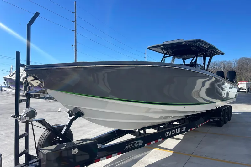 Slide: The Image of 2026 Nor- 390 Sport boat on trailer, sleek design, parked outdoors. - 9