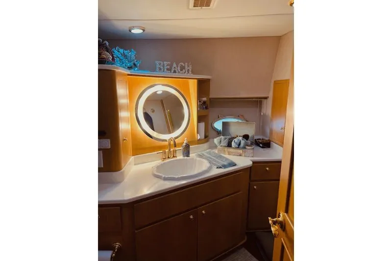Slide: The Image of Luxurious bathroom in 1996 Forbes Cooper pilot house yacht with elegant vanity and lighting. - 16