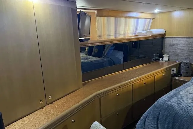 Slide: The Image of Luxurious interior of a 1996 Forbes Cooper pilot house yacht with wood cabinetry. - 17