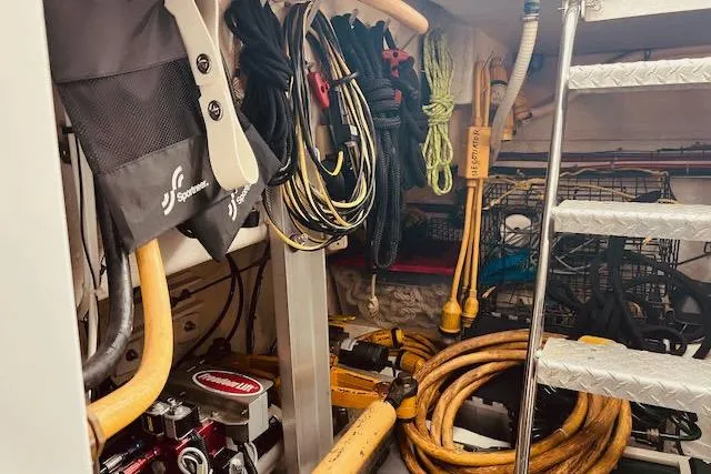 Slide: The Image of Storage area in a 1996 Forbes Cooper pilot house with ropes and equipment. - 21