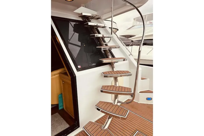 Slide: The Image of Staircase on 1996 Forbes Cooper pilot house yacht with wooden steps and sleek design. - 3